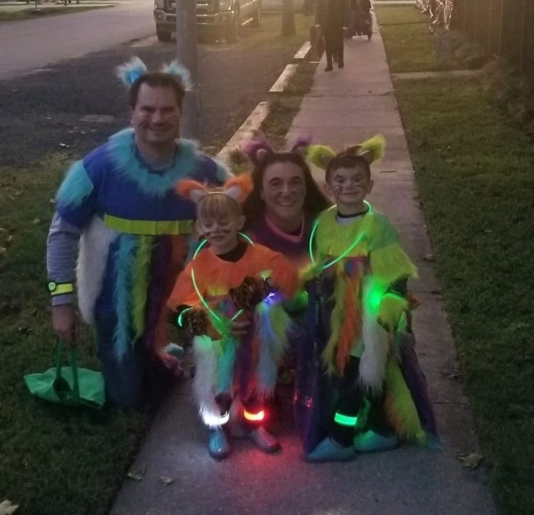 a family dressed as rainbow kitties for Halloween