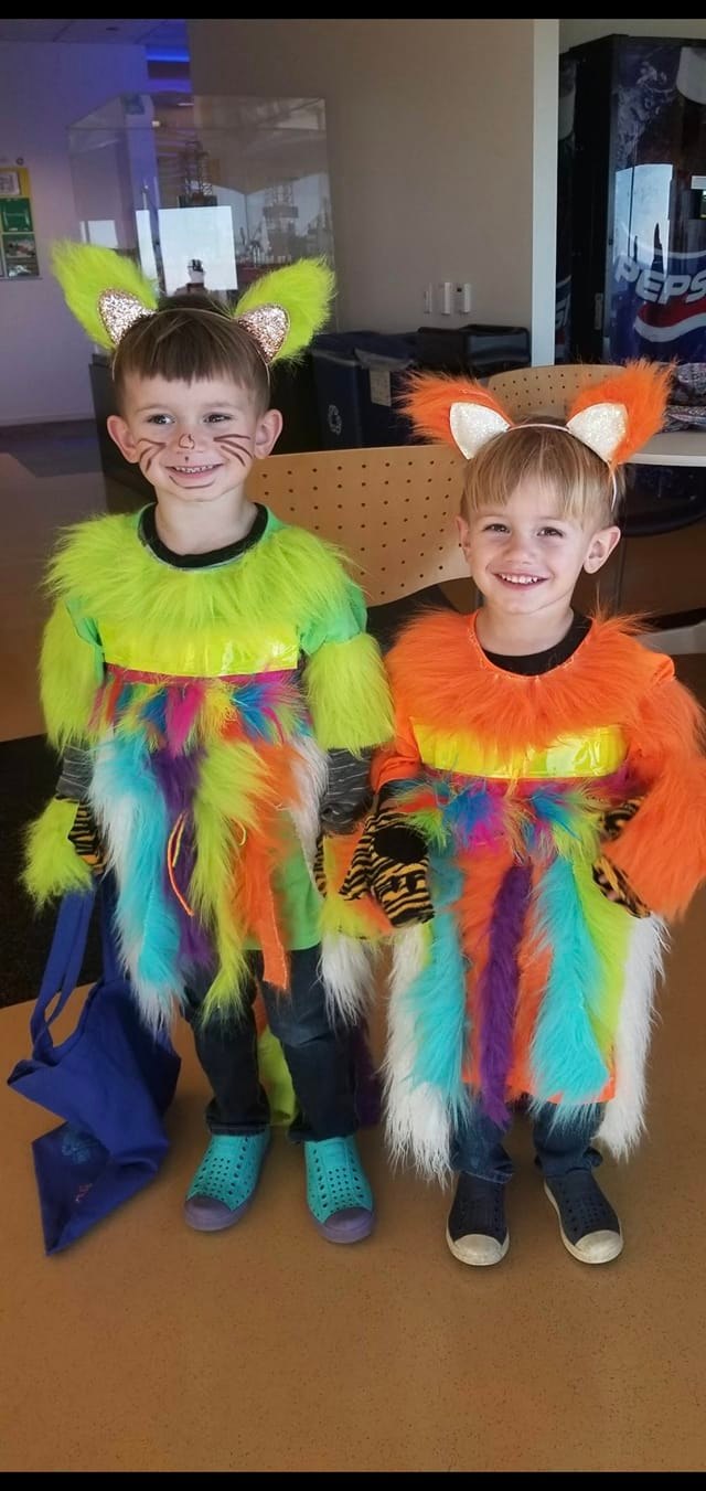 Two boys dressed as rainbow kitties