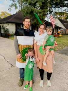 A family wearing Starbucks-themed Halloween costumes