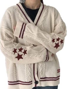 cream cardigan with burgundy stripes and stars on the trim