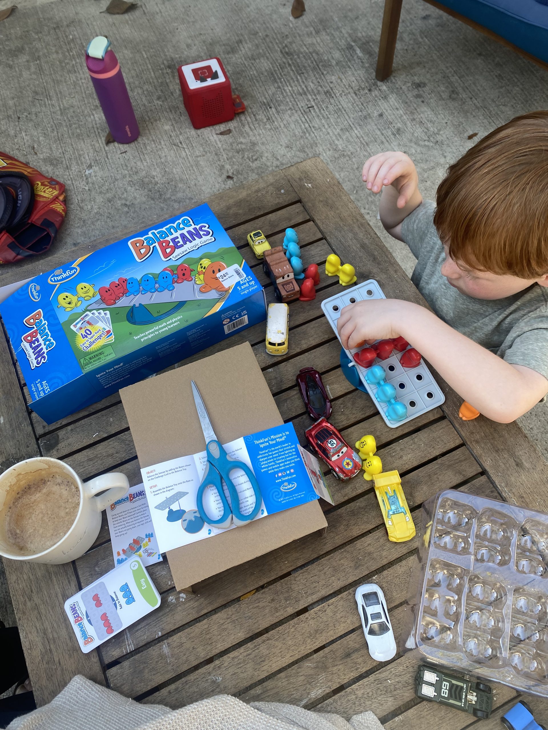child playing single player games outside on patio