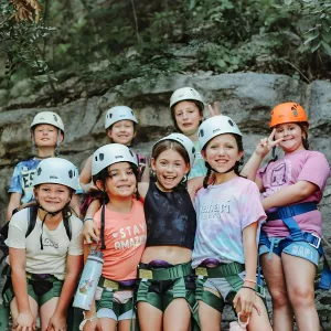 group of girls in climbing helmets