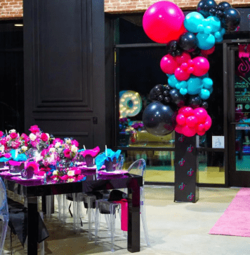 Birthday party set up with decorated table and balloons