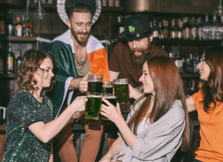group toasts with green beer