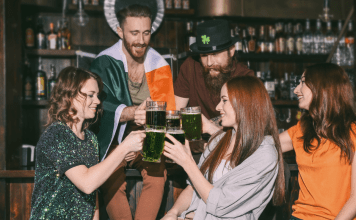 group toasts with green beer