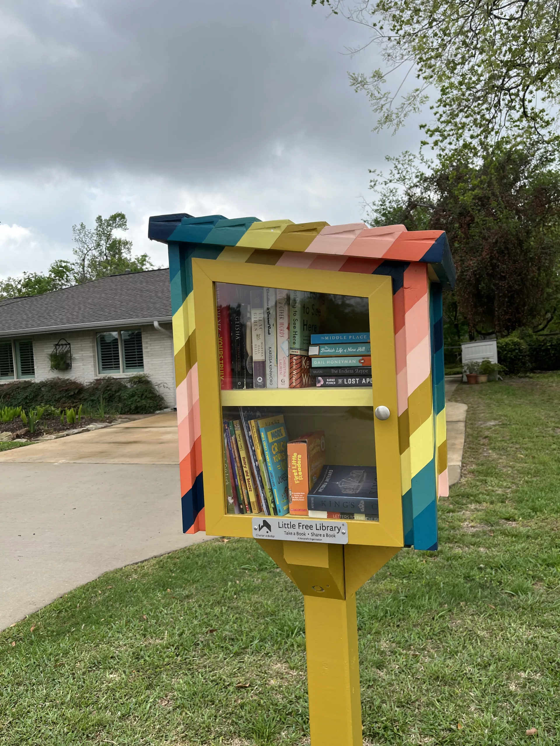 Yellow and Rainbow little free library