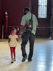 father walking with daughter having tatrums