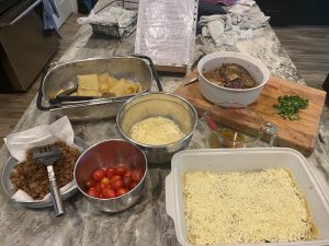 counter full of ingredients to make eggplant lasagna