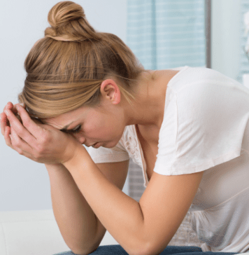 Stress Relief Tips for Moms stressed mom with head in hands