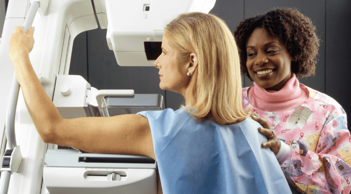 The Truth About Breast Cancer Every Woman Needs to Know woman getting mammogram