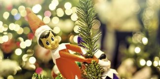 25 Elf on the Shelf Ideas to Delight Your Kids in December Elf on the Shelf hangs from an ornament