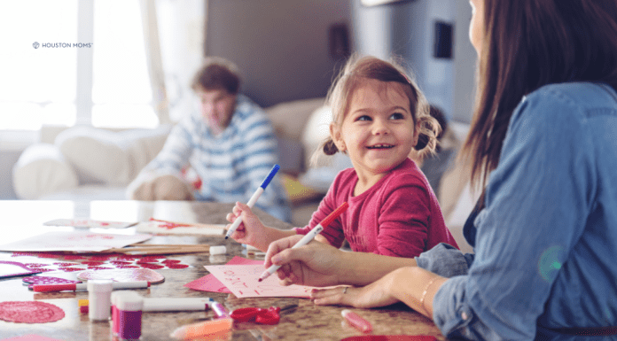 child and mother celebrating Valentine's Day at home