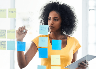 woman with post its of goals on mirror