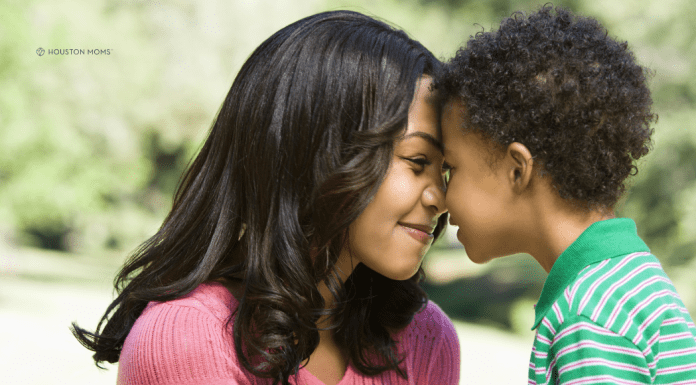 The Consequences of Pregnancy: Emotional Damage mother and son with foreheads together, smiling
