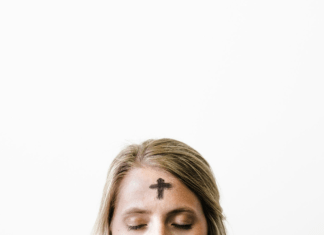 woman with cross ashes on head