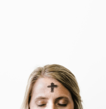 woman with cross ashes on head