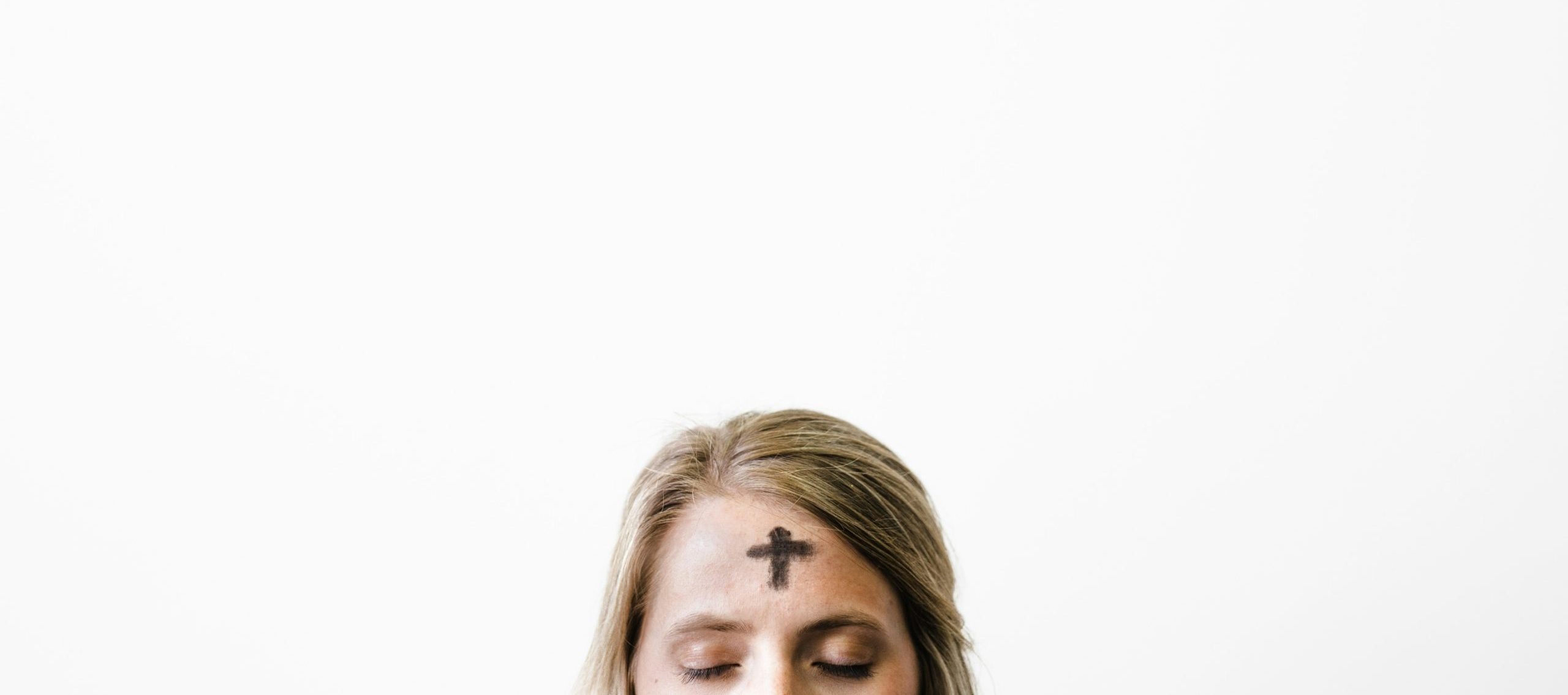 woman with cross of ashes on her forehead
