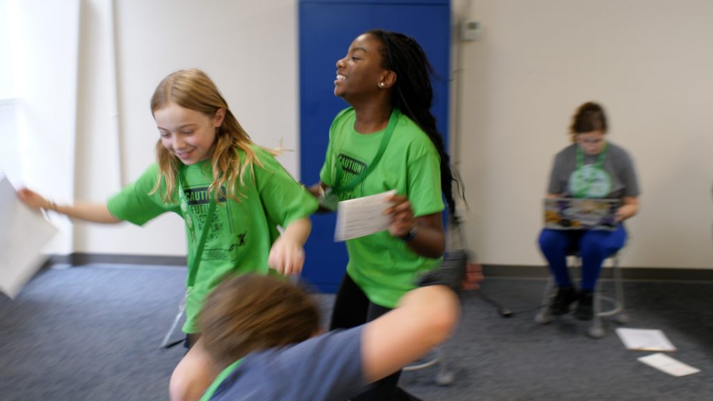 Kids playing and laughing at theatre camp