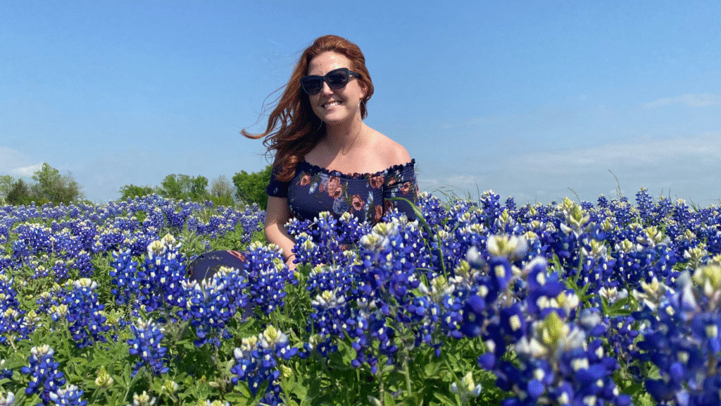 Houston Moms co-owner Brandi Smith in a field of bluebonnets near Brenham