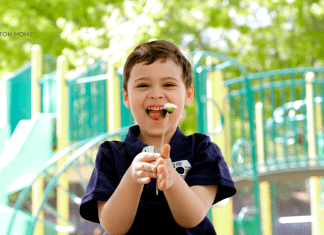 Embracing Neurodiversity: Celebrating World Autism Day boy with autism holds flower