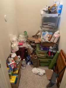 corner of room with clutter stacked up