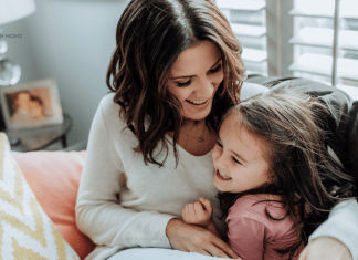 Motherhood Musings from Real Moms Mother cuddling with daughter