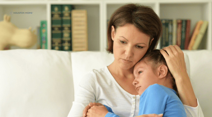 Helping Children and Parents Process Grief mother and young child on the couch, cuddling in grief