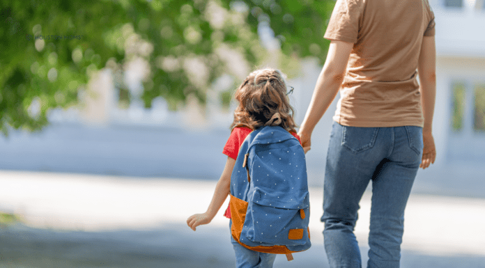 Helping Parents and Children Cope with School Transitions mother walking her child to school
