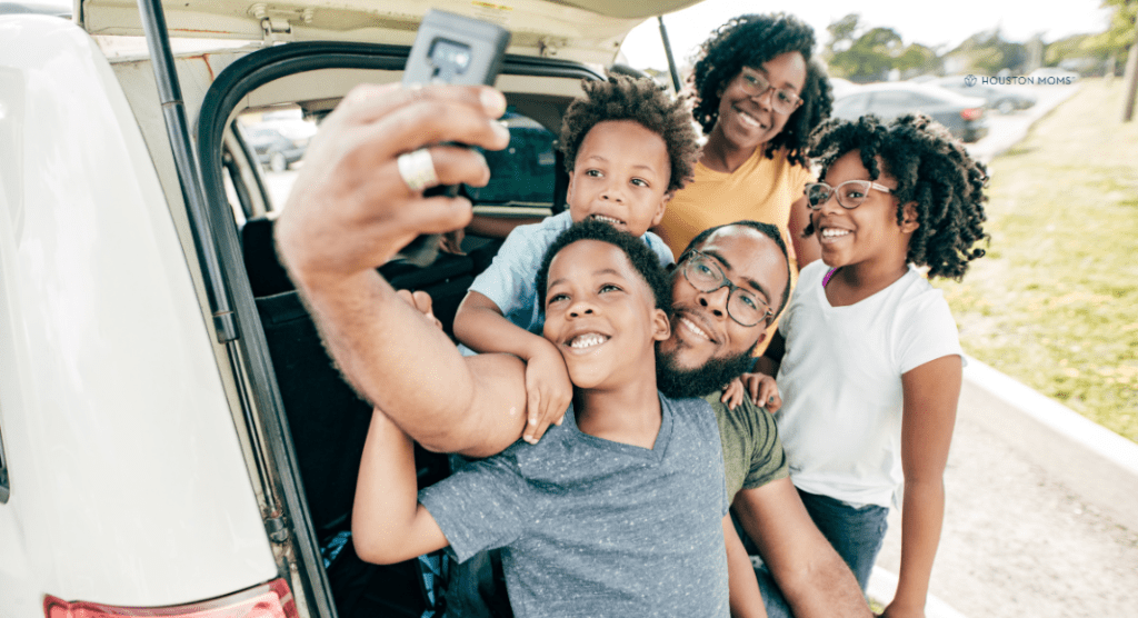 Family taking selfie before leaving for summertime travel in Texas