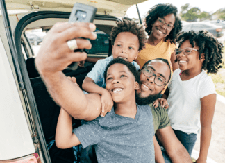Family taking selfie before leaving for summertime travel in Texas