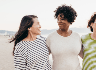 Divorce Support for Moms of Special Needs Kids friends hugging on a beach