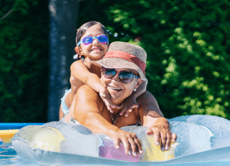 mom on a pool float with her girl riding on her back