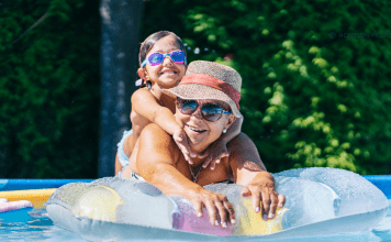 What I’m NOT Doing This Summer (The ANTI Bucket List) mom on a pool float with her girl riding on her back