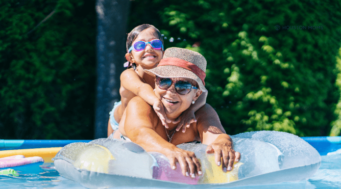 What I’m NOT Doing This Summer (The ANTI Bucket List) mom on a pool float with her girl riding on her back