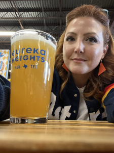 Woman with a glass of beer from Eureka Heights
