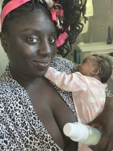 mother holding newborn