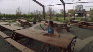 child sitting at picnic table