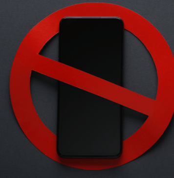 Texas Schools’ New Device Ban: What Parents are Saying and How to Navigate It cell phone with ban symbol over it