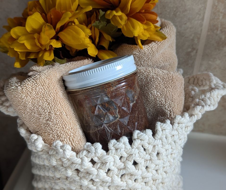 jar tucked in with flowers and towels