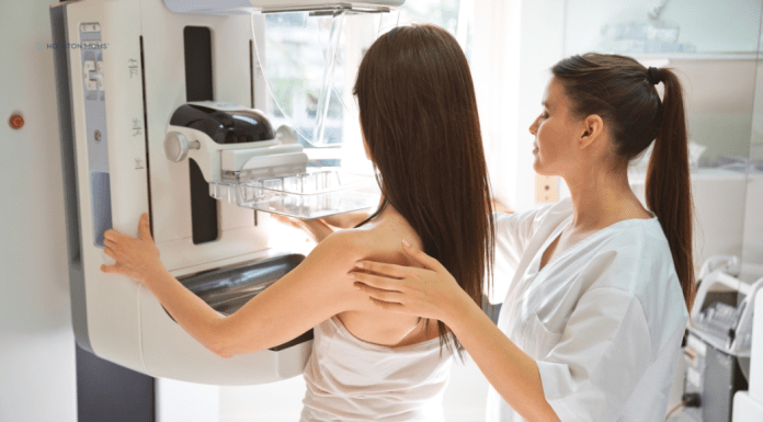 Health Screenings Every Mom Should Prioritize nurse assists woman getting mammogram