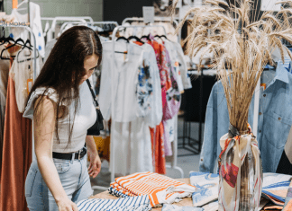 A Former Fashion Buyer’s Take on Budget-Friendly Fall Fashion in Houston woman shopping for clothes