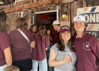 mother and son stand in The Dixie Chicken in College Station