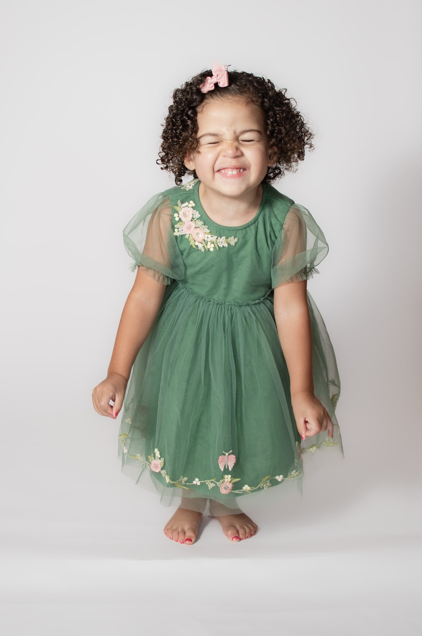 Danielle West Photography portrait Toddler making faces during studio photo session by Danielle West Photography