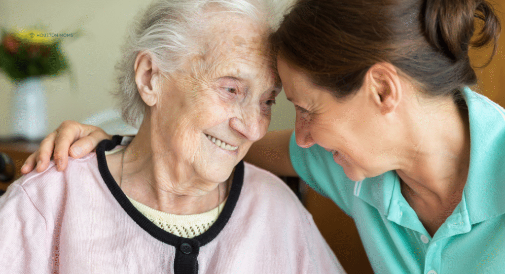 younger woman sits with younger woman with Alzheimer's 