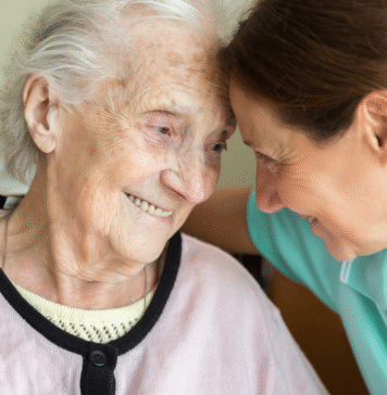 Alzheimer’s Awareness: What You Need to Know younger woman sits with younger woman with Alzheimer's