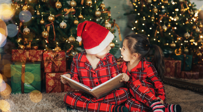 children reading holiday books under the Christmas tree