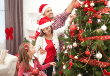 family decorating a tree
