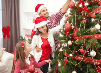 family decorating a tree