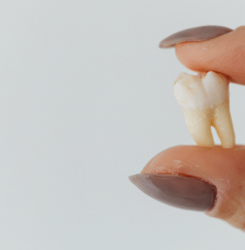 Tooth Fairy Fail fingers holding tooth