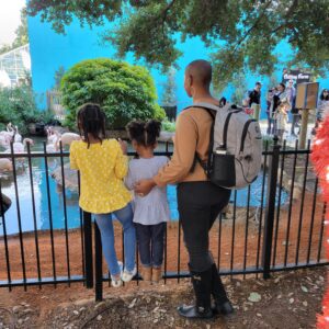 family looking over a fence